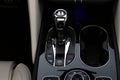 Closeup of black Bentley Bentayga gear selector knob with logo, black piano, center console