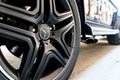 Closeup of a black car tire with a Mercedes-Benz star. German car manufacturer of luxury cars.