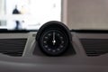 Closeup of a black dashboard clock on the Porsche 911 Sport Chrono