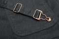 Closeup of a black denim with copper elements and seams Royalty Free Stock Photo