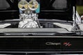 Closeup of a 1968 black Dodge Charger 's engine.