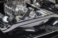 Closeup of a black 1968 Dodge Charger 's engine.