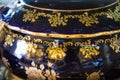 Closeup of black gilded pot