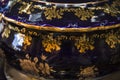 Closeup of black gilded pot