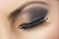 Closeup of black and gold smokey eye Royalty Free Stock Photo