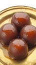 Closeup Black Gulab Jamun, a rich and syrupy delicacy. Royalty Free Stock Photo