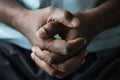 Closeup of black hands grabbed together