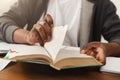 African-american man turning pages of book Royalty Free Stock Photo