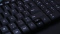 closeup black keyboard on dark background concept