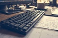 Closeup black keyboard on a working computer setup