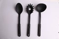 Closeup of black kitchen utensils on white background Royalty Free Stock Photo