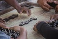 Closeup of black Latinos hands playing dominoes in the neighborhood of La Marina Matanzas, Cuba