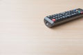 Closeup black remote control on the wood background Royalty Free Stock Photo