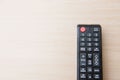 Closeup black remote control on the wood background Royalty Free Stock Photo