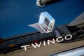 Closeup of black Renault Twingo logo on rear car parked in the street