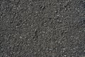 Closeup black rough asphalt road
