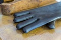 Closeup of black rubber glove on wooden table