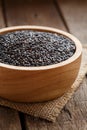 Closeup black sesame in bowl organic grains herb
