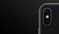 Closeup black similar to iPhone X smartphone dual camera module on black background banner with copyspace Royalty Free Stock Photo