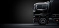 Closeup on a black truck isolated on a dark background, copyspace Royalty Free Stock Photo