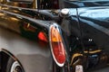 Closeup of a black vintage car.  Back view part of retro car Royalty Free Stock Photo