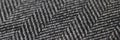 Closeup of black and white herringbone fabric