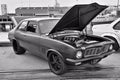 Closeup black and white shot of a Torana LJ in a car show