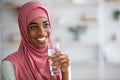 Closeup Of Black Woman In Hijab Drinking Water From Glass At Home Royalty Free Stock Photo