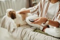 Closeup of black young woman holding remote control watching TV at home Royalty Free Stock Photo