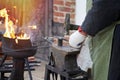 Closeup blacksmith with a hammer