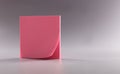 Closeup of block of pink note paper on gray background Royalty Free Stock Photo