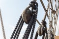 Closeup of block and tackle, wrapped rope and rigging detail on an old sailing ship Royalty Free Stock Photo