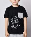 Closeup of blond kid boy in black t-shirt with cartoon dinosaur print picture and gray pocket