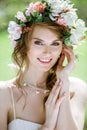 Closeup blonde bride with fashion wedding hairstyle and makeup