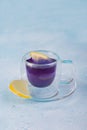 Closeup blue anchan tea on the blue background. Blue tea Butterfly pea with lemon