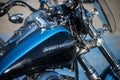 Closeup of blue and black  tank on Harley Davidson motorbike parked in the street Royalty Free Stock Photo