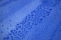 Closeup blue car paint surface with hydrophobic ceramic coating Royalty Free Stock Photo