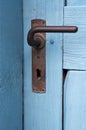 Closeup of blue door with old doorhandle Royalty Free Stock Photo