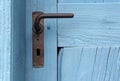 Closeup of blue door with old doorhandle Royalty Free Stock Photo