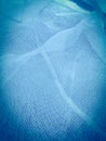 Closeup of blue gauze material fabri..