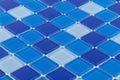 Closeup of blue glass mosaic tiles under the lights Royalty Free Stock Photo