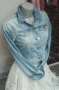 blue jeans jacket and white dress on mannequin in wom