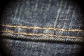 Closeup on blue jeans stitching and button Royalty Free Stock Photo