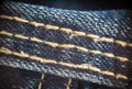 Closeup on blue jeans stitching and button Royalty Free Stock Photo