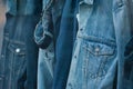 blue jeans trousers and jacket on hangers in fashion Royalty Free Stock Photo