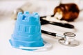 Beach pail and pills on the doctors desk