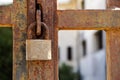 Closeup a blue rusty old metal door locked with a metal padlock. Grunge style and good texture. Security concept. Royalty Free Stock Photo