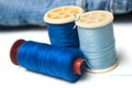 Blue sewing thread spool bobbins on white background Royalty Free Stock Photo