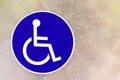 Closeup blue sign white symbol wheelchair disability