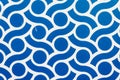 Closeup of a blue and white rotating pattern on the wall